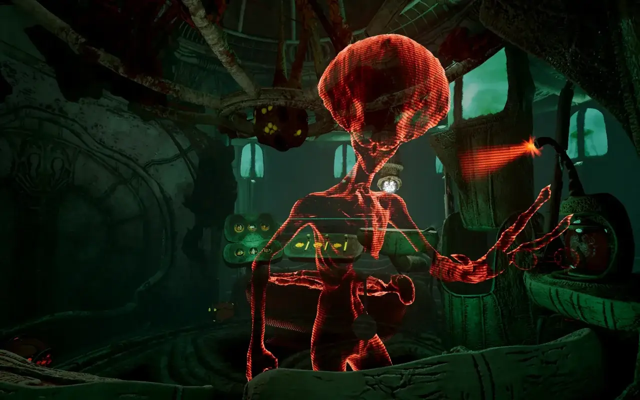 Glowing red hologram of an alien figure inside the greenish spaceship interior