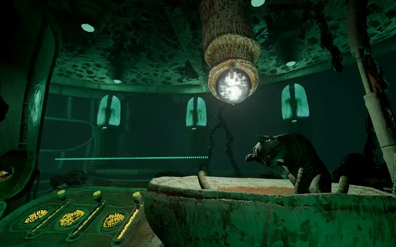 Organic-looking room aboard the spaceship with green light and a hanging glowing orb