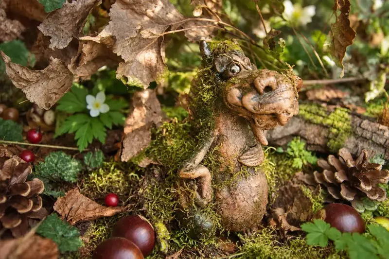 Small woodland creature among moss and pinecones